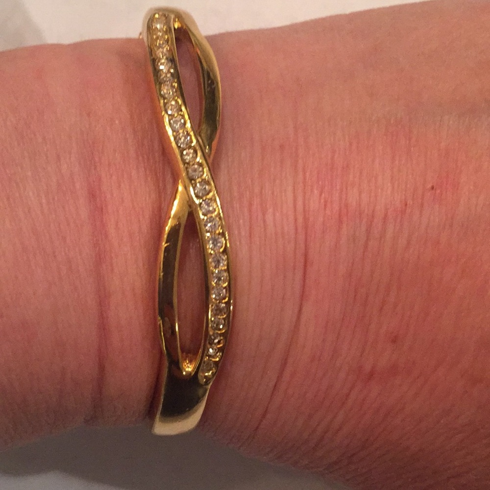 Gold tone rhinestone latching bangle bracelet